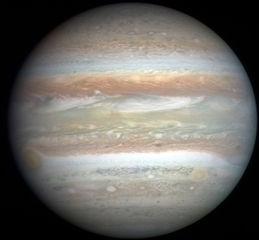 The banded disk of Jupiter.