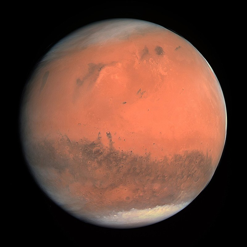 The reddish disk of Mars.